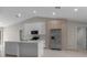 Bright kitchen with stainless steel appliances, island with a sink, and plenty of storage at 23367 Mayville Ave, Punta Gorda, FL 33980