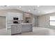 Contemporary kitchen offers a central island, stainless steel appliances, and a modern design at 23367 Mayville Ave, Punta Gorda, FL 33980