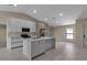 Stylish kitchen showcases modern appliances, a central island with bar seating, and sleek cabinetry at 23367 Mayville Ave, Punta Gorda, FL 33980