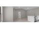 Spacious living room shows a view to the open floor plan and access to other rooms at 23367 Mayville Ave, Punta Gorda, FL 33980