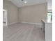 Open living area with white floor and neutral walls at 23367 Mayville Ave, Punta Gorda, FL 33980