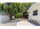 Expansive backyard featuring a screened porch, mature trees, and a peaceful outdoor setting at 2363 Milford Cir, Sarasota, FL 34239