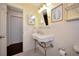 Bathroom featuring a vintage sink and a yellow color scheme at 2363 Milford Cir, Sarasota, FL 34239