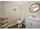 Powder room featuring tile flooring and a half wall shelve at 2363 Milford Cir, Sarasota, FL 34239