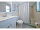 Bathroom featuring white tiling and a bathtub with a shower curtain at 2363 Milford Cir, Sarasota, FL 34239