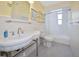 Bathroom featuring a vintage sink and tub-shower combo at 2363 Milford Cir, Sarasota, FL 34239