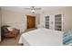 A bedroom with a queen-size bed and a seating area at 2363 Milford Cir, Sarasota, FL 34239