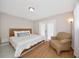 Bedroom featuring a sliding glass door and comfy chair at 2363 Milford Cir, Sarasota, FL 34239