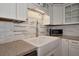 A kitchen showcasing a farmhouse sink and stainless steel appliances at 2363 Milford Cir, Sarasota, FL 34239