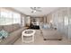 Open-concept living room seamlessly connects to the dining area and kitchen, promoting effortless entertaining at 2363 Milford Cir, Sarasota, FL 34239