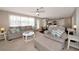 Bright and airy living room featuring neutral tones, comfortable seating, and an open layout with seamless kitchen access at 2363 Milford Cir, Sarasota, FL 34239