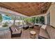 Inviting screened patio with comfortable seating, stylish furnishings, and overhead string lights at 2363 Milford Cir, Sarasota, FL 34239