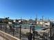 Community pool surrounded by a black metal fence and plenty of tables and chairs at 2601 Gulf N Dr # B4, Bradenton Beach, FL 34217
