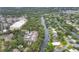 Aerial view showcasing the community's proximity to the river and nearby shopping areas at 2740 Orchid Oaks Dr # 304, Sarasota, FL 34239