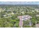 Aerial view of community surrounded by lush greenery and waterways at 2740 Orchid Oaks Dr # 304, Sarasota, FL 34239