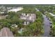 Aerial perspective of community, highlighting the pool and nearby waterway at 2740 Orchid Oaks Dr # 304, Sarasota, FL 34239