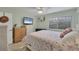 Bedroom featuring a flamingo-themed comforter and a bright, sunny window at 2740 Orchid Oaks Dr # 304, Sarasota, FL 34239