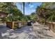 Outdoor deck features a grill, table, and chairs, perfect for relaxing and entertaining guests amid lush landscaping at 2740 Orchid Oaks Dr # 304, Sarasota, FL 34239