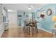 Dining area features a view into the kitchen with a pass-through window at 2740 Orchid Oaks Dr # 304, Sarasota, FL 34239