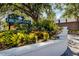 Orchid Oaks sign surrounded by a lush landscaped entrance at 2740 Orchid Oaks Dr # 304, Sarasota, FL 34239