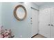 Welcoming entryway with stylish mirror and neutral walls, creating a bright and inviting space at 2740 Orchid Oaks Dr # 304, Sarasota, FL 34239