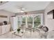 Cozy Florida room featuring wicker furniture and outdoor views from sliding doors at 2740 Orchid Oaks Dr # 304, Sarasota, FL 34239