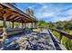 Wooden gazebo and boardwalk offers scenic waterfront access and a shaded area to relax at 2740 Orchid Oaks Dr # 304, Sarasota, FL 34239