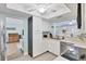 Functional kitchen with white cabinetry, stainless steel appliances, and a convenient layout at 2740 Orchid Oaks Dr # 304, Sarasota, FL 34239