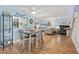 Spacious living area seamlessly blends into the dining area and includes built-in shelving at 2740 Orchid Oaks Dr # 304, Sarasota, FL 34239