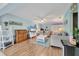 Cozy living room with hardwood floors, comfortable couches, and ample natural light at 2740 Orchid Oaks Dr # 304, Sarasota, FL 34239