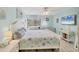 Serene main bedroom featuring coastal decor, a ceiling fan, and bright, natural light at 2740 Orchid Oaks Dr # 304, Sarasota, FL 34239