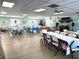Spacious banquet room with tables, chairs, and decorations for events at 3272 Lake Bayshore Dr # 515, Bradenton, FL 34205