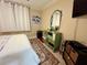 Bedroom with a decorative dresser and matching mirror and decorative area rug at 3272 Lake Bayshore Dr # 515, Bradenton, FL 34205