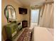View of bedroom showcasing dresser with mirror and access to the closet at 3272 Lake Bayshore Dr # 515, Bradenton, FL 34205