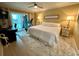Well-lit bedroom with a comfortable bed, desk area, and sliding glass doors to the outside at 3272 Lake Bayshore Dr # 515, Bradenton, FL 34205
