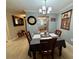 Cozy dining area with a view into the kitchen, featuring a black and white checkered tablecloth at 3272 Lake Bayshore Dr # 515, Bradenton, FL 34205