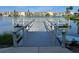 Community dock on the lake with Adirondack chairs provides a relaxing spot at 3272 Lake Bayshore Dr # 515, Bradenton, FL 34205