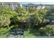 Exterior shot showing an overview of trees and the community from a building window at 3272 Lake Bayshore Dr # 515, Bradenton, FL 34205