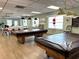 Inviting game room with pool tables, providing recreational opportunities for residents and guests at 3272 Lake Bayshore Dr # 515, Bradenton, FL 34205