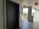 Hallway with elevator, showcasing natural light and views of the community at 3272 Lake Bayshore Dr # 515, Bradenton, FL 34205