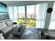 Relaxing lanai featuring comfortable seating and views of the property and blue sky at 3272 Lake Bayshore Dr # 515, Bradenton, FL 34205