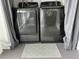 Laundry area featuring modern front-load washer and dryer at 3272 Lake Bayshore Dr # 515, Bradenton, FL 34205