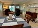 View of an open-concept floor plan with living room and dining area with sliding doors to the lanai at 3272 Lake Bayshore Dr # 515, Bradenton, FL 34205