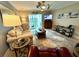 Comfortable living room with neutral tones, stylish rug, a ceiling fan and a balcony with a view at 3272 Lake Bayshore Dr # 515, Bradenton, FL 34205