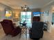 Open-concept living room features comfortable seating, stylish decor, and access to a balcony with scenic views at 3272 Lake Bayshore Dr # 515, Bradenton, FL 34205