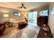 Cozy living room boasts a neutral palette, plush seating, and seamless access to the outdoor balcony at 3272 Lake Bayshore Dr # 515, Bradenton, FL 34205