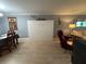 Living room with a Murphy bed, dining table, and seating area at 3272 Lake Bayshore Dr # 515, Bradenton, FL 34205