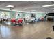 Spacious meeting room featuring tables and chairs, perfect for community gatherings and events at 3272 Lake Bayshore Dr # 515, Bradenton, FL 34205