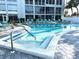 Sparkling community pool featuring clear water and comfortable lounge chairs at 3272 Lake Bayshore Dr # 515, Bradenton, FL 34205