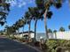 Street view with palm trees and blue sky at 3272 Lake Bayshore Dr # 515, Bradenton, FL 34205